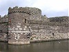 Beaumaris castle wales welsh uk side view with moat water